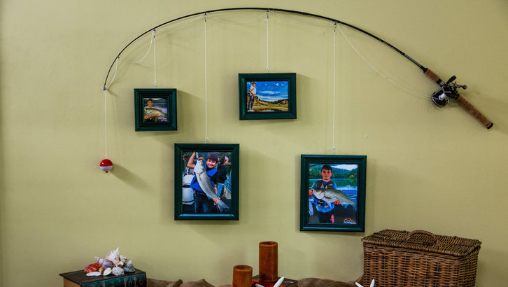 Fishing pole photo frame from a thrift store