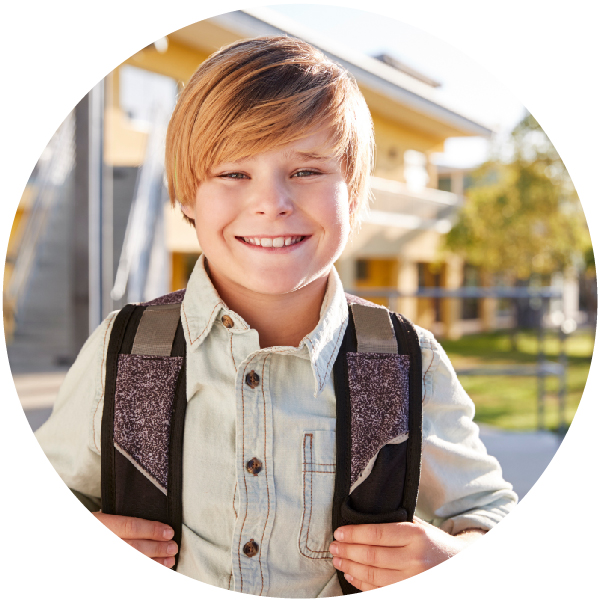 School age boy with backpack